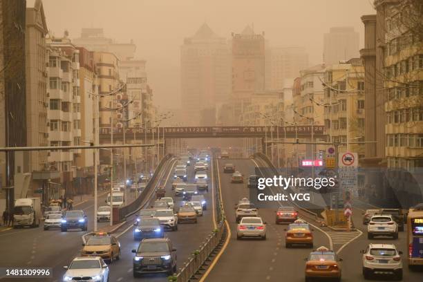 Cars drive in a sandstorm on April 10, 2023 in Harbin, Heilongjiang Province of China.