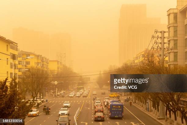 Cars drive in a sandstorm on April 10, 2023 in Hohhot, Inner Mongolia Autonomous Region of China.
