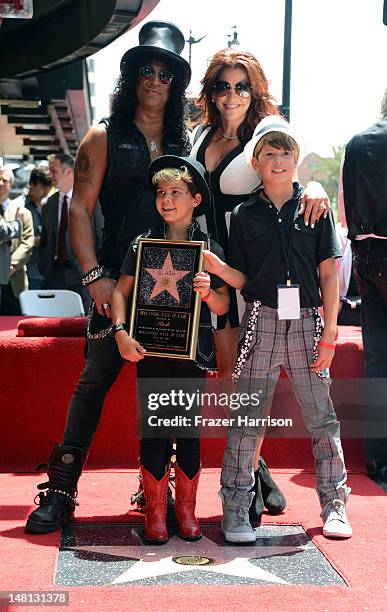 Musician Slash with his family Perla Ferrar, London and Cash attend the 2,473rd Star on the Hollywood Walk of Fame ceremonyin honor of Slash outside...