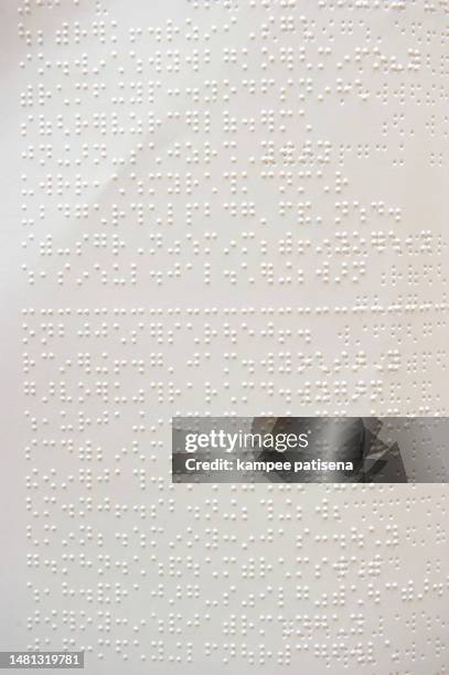 hands and braille (thail language) - braille stock pictures, royalty-free photos & images