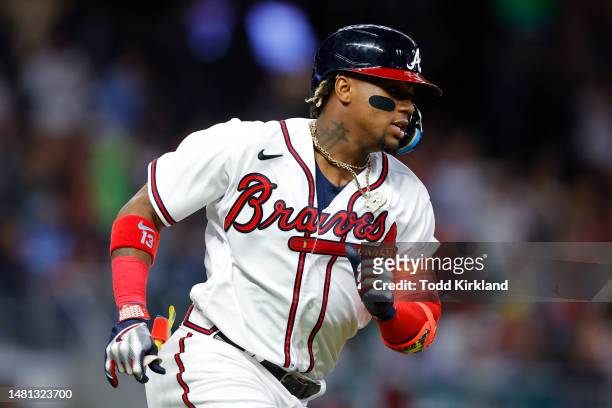 Ronald Acuna Jr. #13 of the Atlanta Braves races to first for a single during the seventh inning against the Cincinnati Reds at Truist Park on April...