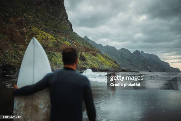 surfers friends at taganana beach in tenerife canarias - teneriffa bildbanksfoton och bilder