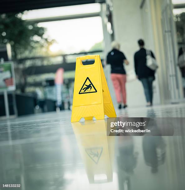 warning sign slippery - slippery stock pictures, royalty-free photos & images