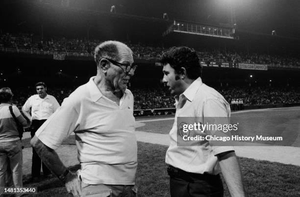 Bill Veeck, president of the Chicago White Sox, tries to reason with umpires and Sparky Anderson, Detroit Tiger manager, after a crowd rushed...