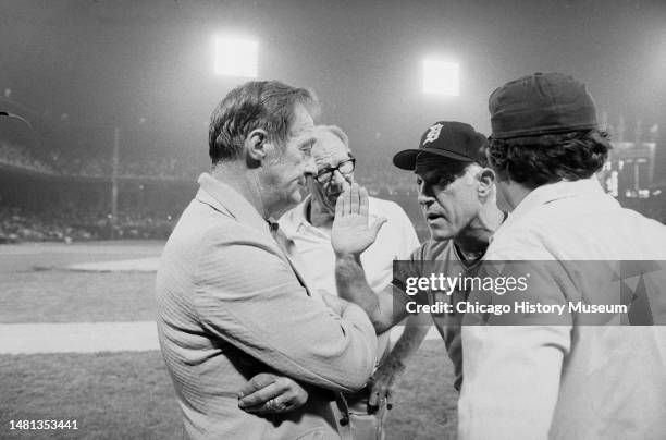 Bill Veeck, president of the Chicago White Sox, tries to reason with umpires and Sparky Anderson, Detroit Tiger manager, after a crowd rushed...