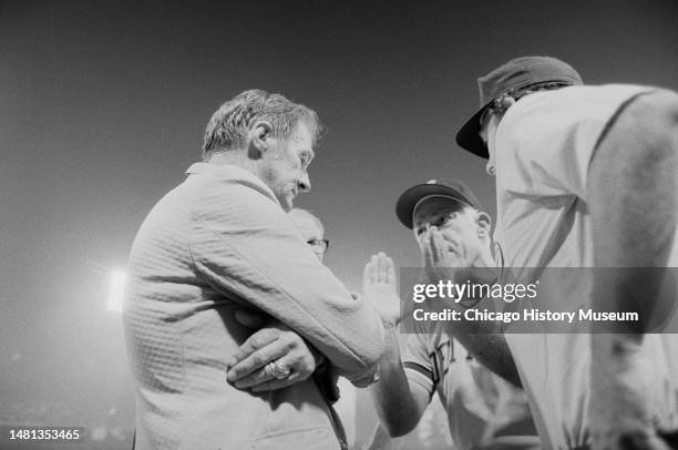 Bill Veeck, president of the Chicago White Sox, tries to reason with umpires and Sparky Anderson, Detroit Tiger manager, after a crowd rushed...