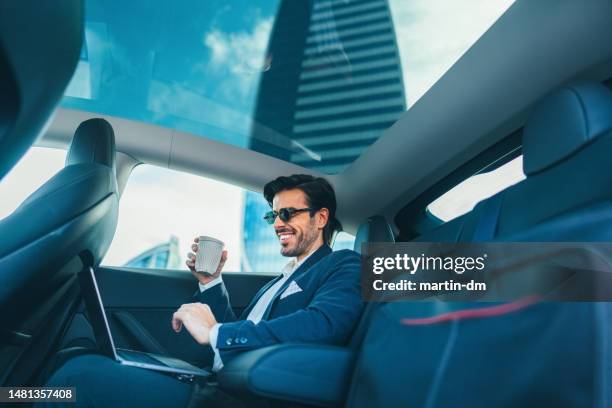 businessman in traffic jam works from the car - vip travel stock pictures, royalty-free photos & images