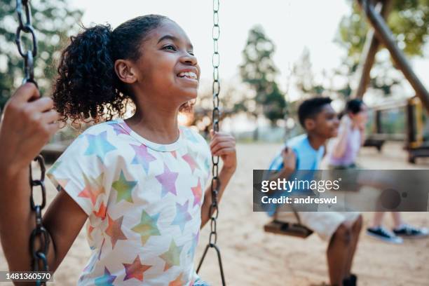 children playing in the playground - day 10 imagens e fotografias de stock
