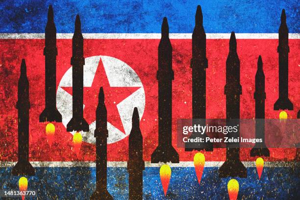 north korea flag with nuclear missiles - democratic peoples republic of korea stock pictures, royalty-free photos & images