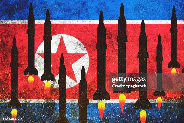 north korea flag with nuclear missiles - coreia do norte imagens e fotografias de stock