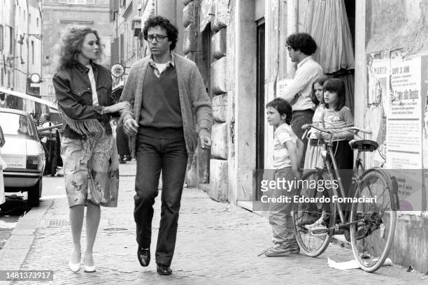 The French actress Corinne Clery with the Italian actor Enrico Montesano during the filming of 'I Hate Blondes', Rome, May 01, 1980.