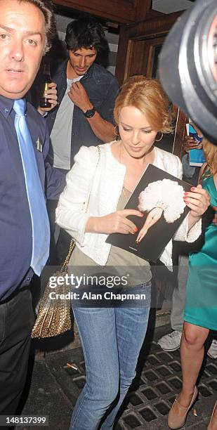 Kylie Minogue and Andres Velencoso sighting leaving The Hurly Burly Show at the Duchess Theatre on July 10, 2012 in London, England.