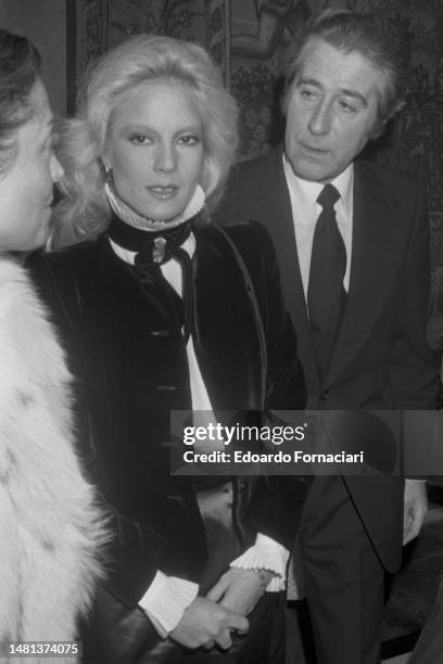 December 8 - The French singer Sylvie Vartan with a friend at a party in Rome, December 8, 1979. .