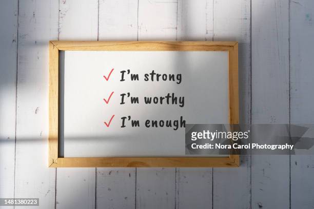 mini white board with text i'm strong, i'm worthy, i'm enough - health motivational quotes stock pictures, royalty-free photos & images