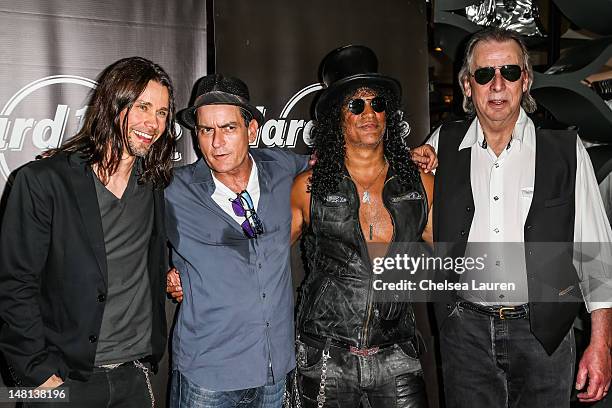 Vocalist Myles Kennedy, actor Charlie Sheen, guitarist Slash and DJ Jim Ladd arrive at Slash's performance at the Hard Rock Cafe on July 10, 2012 in...