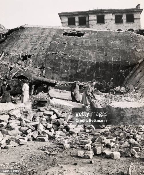 Women known as 'Trümmerfrauen' clear rubble in Berlin, circa 1947.