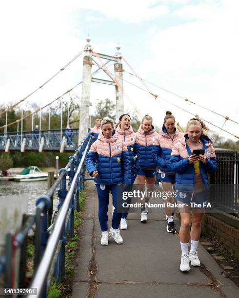 Jordan Nobbs, Lucy Bronze, Hannah Hampton, Lucy Parker and Katie Robinson of England look on during an England Match Day Walk at The Lensbury on...