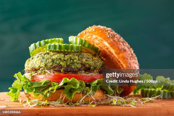 green veggie burger on a brioche bun,manassas,virginia,united states,usa - veggie burger stock pictures, royalty-free photos & images