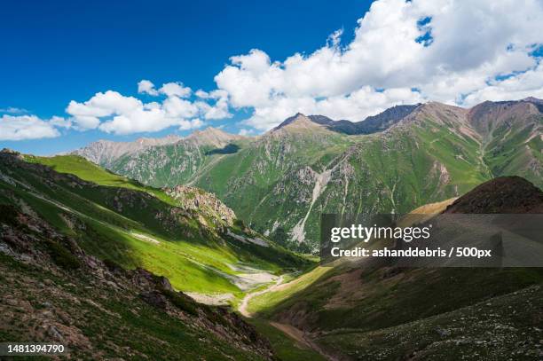 scenic view of mountains against sky,kyrgyzstan - montañas de tien shan fotografías e imágenes de stock