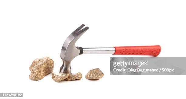 close-up of hammer and nail clipper against white background,moldova - geology tools stock pictures, royalty-free photos & images