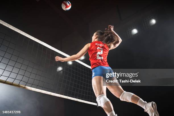 volleyball: female player in action - womens volleyball stock pictures, royalty-free photos & images