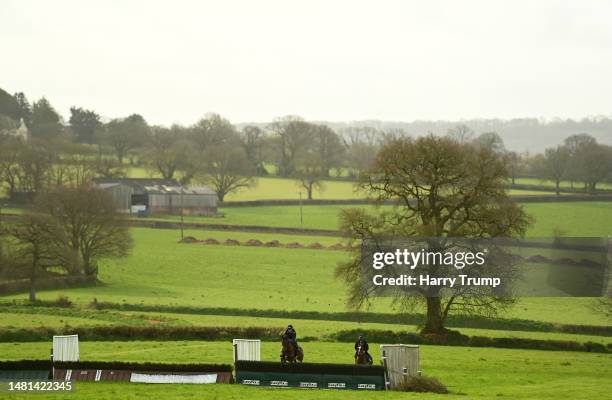 Tom Scudamore on board Eden du houx and Jack Tudor on board Keppage take a flight on the gallops during a David Pipe Stable Visit at Pond House...