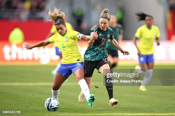 Tamires Britto of Brazil is challenged by Svenja Huth of Germany during the Women's international friendly between Germany and Brazil at...