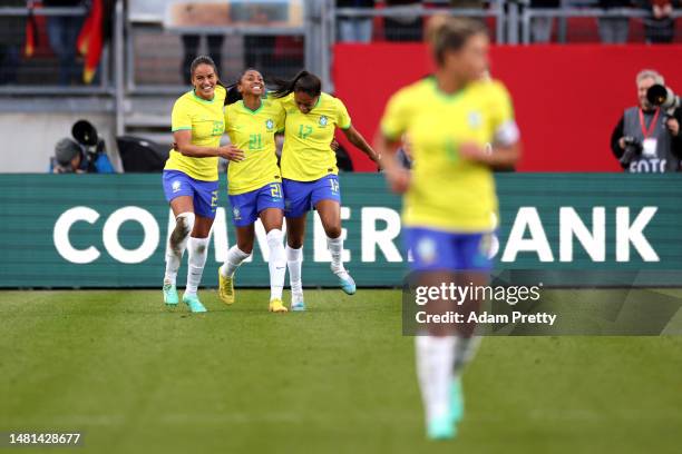 Ary Borges of Brazil celebrates with teammates Kerolin Ferraz and Gabi Nunes after scoring their side's second goal during the Women's international...