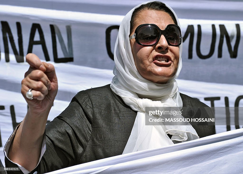 An Afghan woman shouts slogans during a 