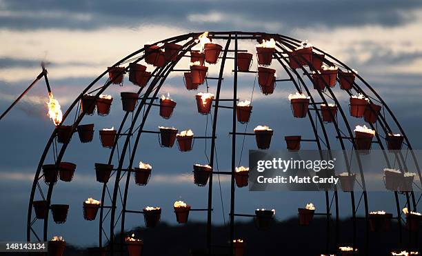 Fires are lit near the ancient megalithic monument of Stonehenge during the Fire Garden as part of the Salisbury International Arts Festival on July...