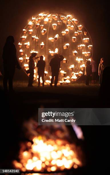 Fires light the ground surrounding the ancient megalithic monument of Stonehenge during the Fire Garden as part of the Salisbury International Arts...