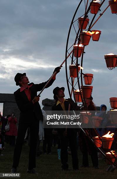 Fires are lit near the ancient megalithic monument of Stonehenge during the Fire Garden as part of the Salisbury International Arts Festival on July...