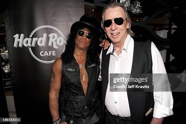 Slash and Jim Ladd pose after Slash's performance at the Hard Rock Cafe on July 10, 2012 in Hollywood, California.