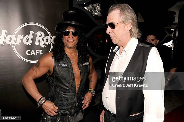 Slash and Jim Ladd pose after Slash's performance at the Hard Rock Cafe on July 10, 2012 in Hollywood, California.