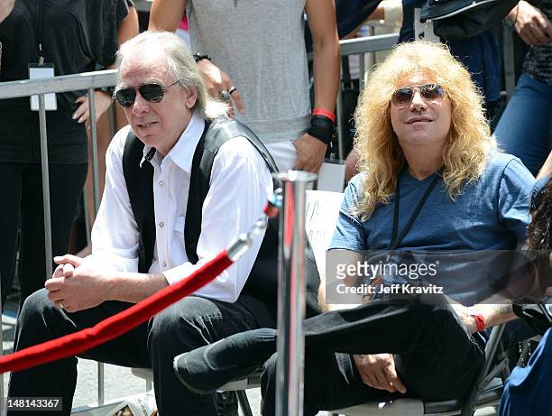 Jim Ladd and Steven Adler watch as Slash is honored with a star on the Hollywood Walk of Fame on July 10, 2012 in Hollywood, California.