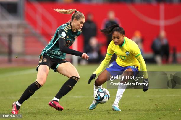 Jule Brand of Germany is challenged by Yasmim Ribeiro of Brazil during the Women's international friendly between Germany and Brazil at...