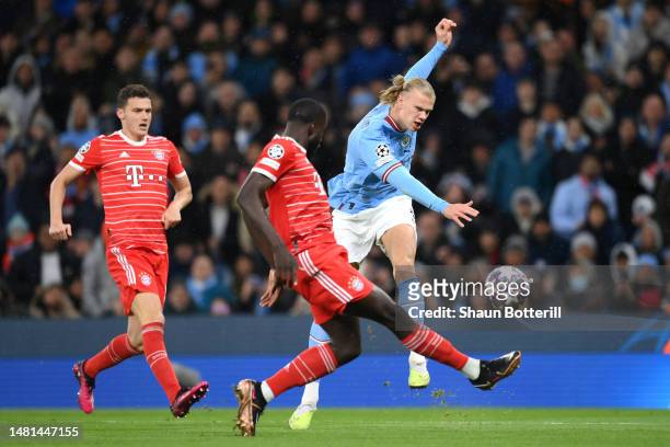 Erling Haaland of Manchester City shoots whilst under pressure from Dayot Upamecano of FC Bayern Munich during the UEFA Champions League quarterfinal...