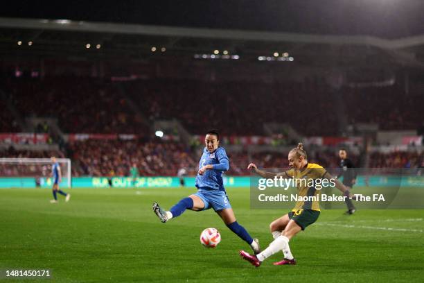 Lucy Bronze of England attempts to block a pass from Tameka Yallop of Australia during the Women's International Friendly match between England and...