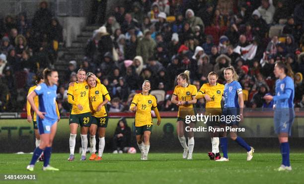 Charlotte Grant of Australia celebrates after scoring the team's second goal with teammates during the Women's International Friendly match between...