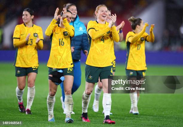Hayley Raso and Clare Polkinghorne of Australia applauds their fans after defeating England during the Women's International Friendly match between...