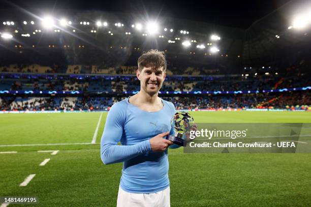 John Stones of Manchester City poses with the PlayStation player of the match award after the team's victory in the UEFA Champions League...