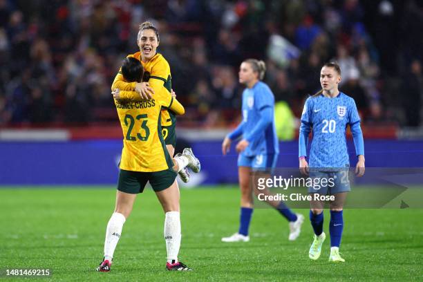 Kyra Cooney-Cross celebrates with teammate Katrina Gorry of Australia after defeating England during the Women's International Friendly match between...