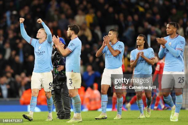 Erling Haaland of Manchester City celebrates alongside teammates Ruben Dias, Rodri, Nathan Ake and Manuel Akanji after the team's victory in the UEFA...