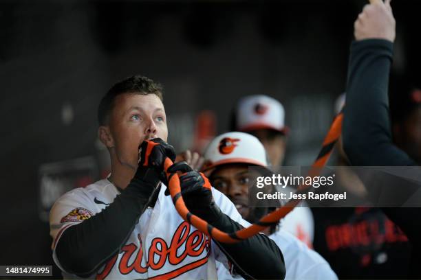 Ryan Mountcastle of the Baltimore Orioles drinks from the "homer hose" after hitting a home run against the Oakland Athletics at Oriole Park at...