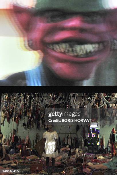 Colombian actor Julian Diaz performs with Mapa Teatro actors from Bogota during a rehearsal of the play "Los Santos Inocentes", first part of a...