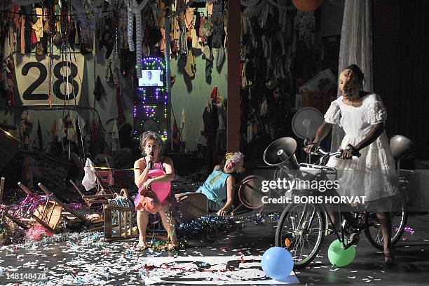 Colombian actress Heidi Abderhalden and actors of the Mapa Teatro from Bogota, perform during a rehearsal of the play "Los Santos Inocentes", first...