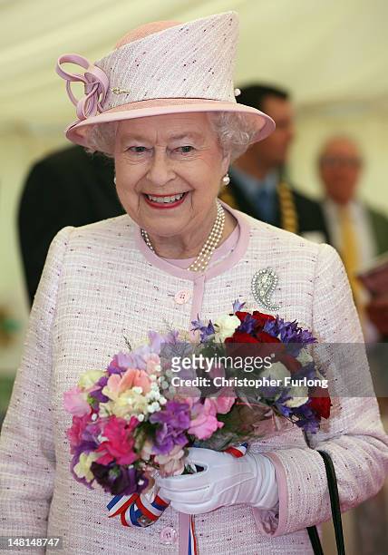 Queen Elizabeth II tours the Herefordshire Diamond Day celebrations at King George V Playing Fields on July 11, 2012 in Hereford, England. The Queen,...