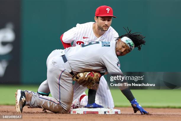 Trea Turner of the Philadelphia Phillies forces out Jean Segura of the Miami Marlins during the second inning at Citizens Bank Park on April 11, 2023...