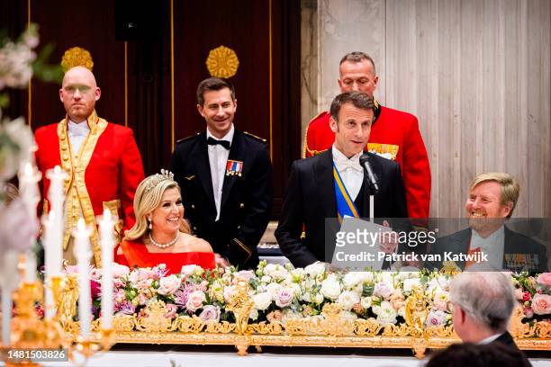 Queen Maxima of the Netherlands, French President Emmanuel Macron and King Willem-Alexander of The Netherlands are seen at the Royal Palace on April...