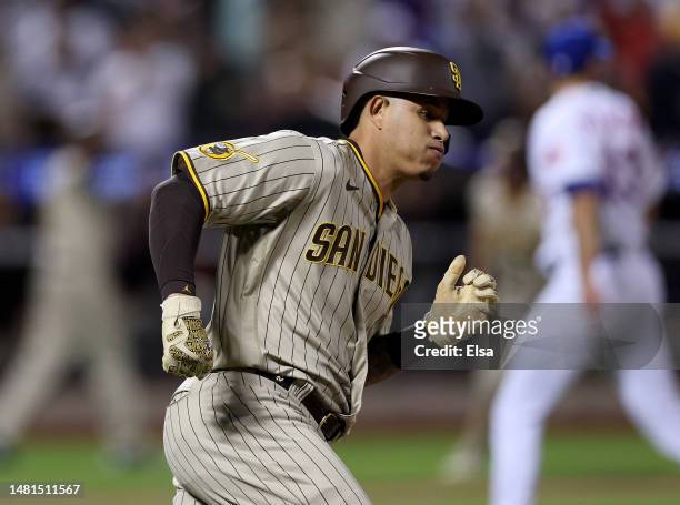 Manny Machado of the San Diego Padres rounds first after he hit a 2RBI double in the fifth inning against the New York Mets at Citi Field on April...